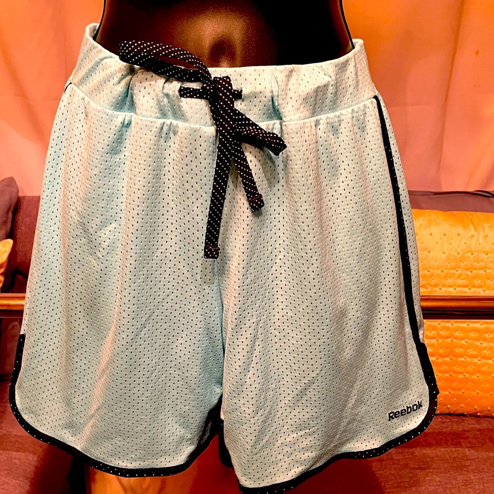 Running Reebok shorts, light blue